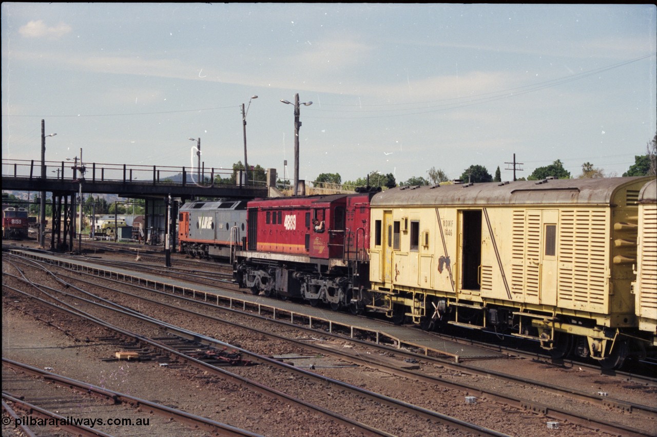 137-2-02
Albury station yard view, NSWSRA 48 class loco 4889 AE Goodwin ALCo model DL531 serial G3420-4 shunts near the station building with an NDMF class bogie guards van NDMF 1446, V/Line G class G 521 is in the background.
Keywords: 48-class;4889;AE-Goodwin;ALCo;RSD-8;DL531;G3420-4;