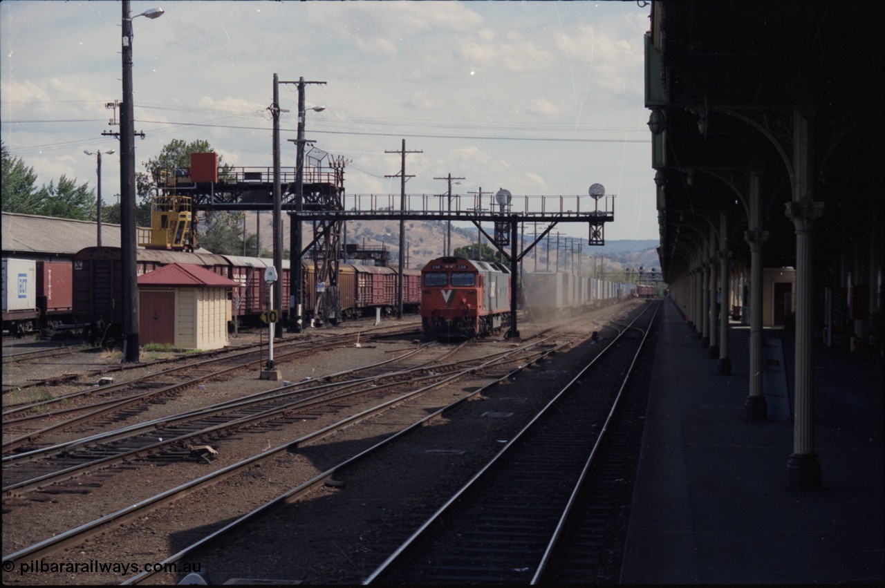 137-2-06
Albury station yard overview, standard gauge V/Line G class G 518 Clyde Engineering EMD model JT26C-2SS serial 85-1231 raises the dust as it cuts off the down goods train, the unit will head to loco, to the left of G 518 is the broad gauge goods loop.
Keywords: G-class;G518;Clyde-Engineering-Rosewater-SA;EMD;JT26C-2SS;85-1231;