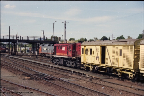 137-2-02
Albury station yard view, NSWSRA 48 class loco 4889 AE Goodwin ALCo model DL531 serial G3420-4 shunts near the station building with an NDMF class bogie guards van NDMF 1446, V/Line G class G 521 is in the background.
Keywords: 48-class;4889;AE-Goodwin;ALCo;RSD-8;DL531;G3420-4;