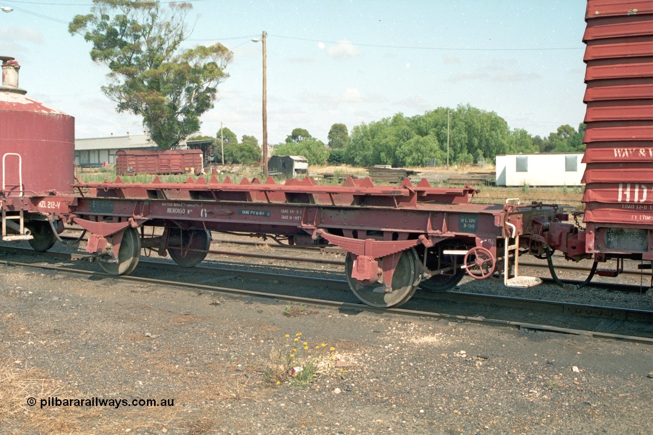 138-09
Bendigo yard, HZL class four wheel, wheel set waggon HZL 212, stencilled 'Motor Bogie Transportation Bendigo Nth'. This waggon has an interesting history, built new in June 1919 as six wheel U class van U 989, converted to HR class HR 78 (2nd) in 1979, then to HZL class in 1985.
Keywords: HZL-type;HZL212;U-type;U989;fixed-wheel-waggon;