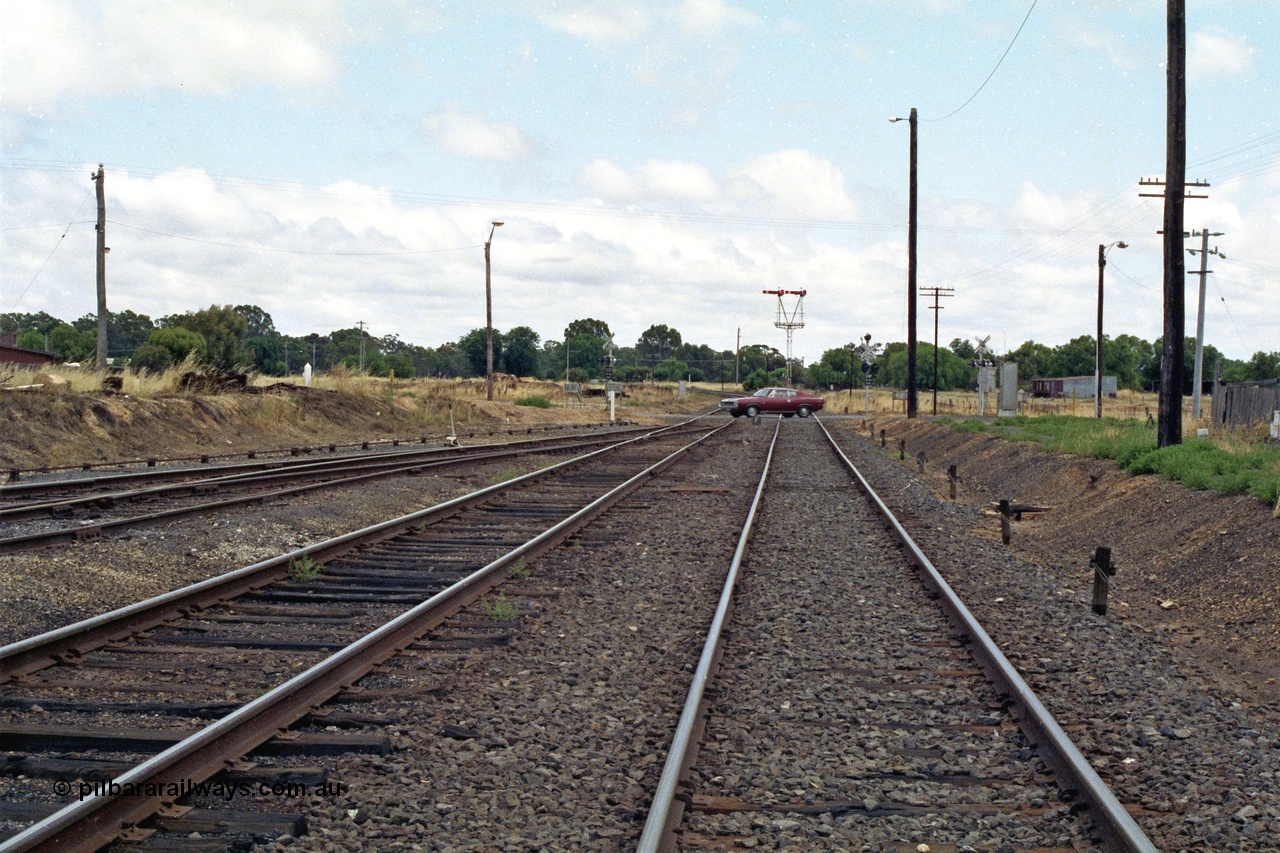 138-20
Dunolly, yard view looking north from station, Mildura line curves to the left, and the Inglewood line to the right, on the other side of the Valiant Charger!, Semaphore signal post 2 is the down departure for both lines.
