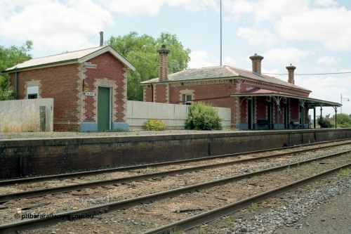 138-24
Talbot station overview, built around 1875, platform, brick lamp room and station building, track view, looking north.
