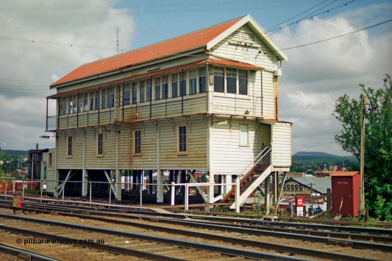 139-06
Ballarat yard, Ballarat A Signal Box, track view, north west elevation, point rodding easily visible with town below.
