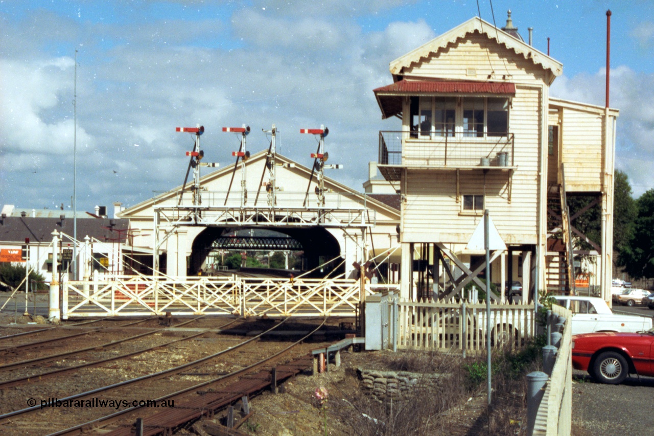 139-15
Ballarat station view, Ballarat B Signal Box at Lydiard St showing the interlocked gates and looking through to the semaphore signal gantry and station building and canopy. The signal posts on the gantry are from the left, 
