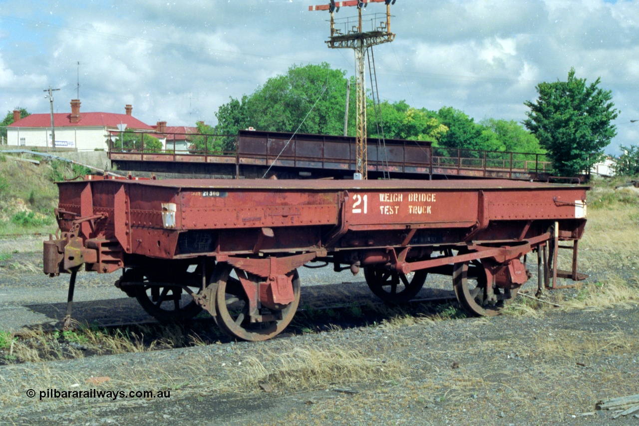 139-18
Ballarat, Doveton Street Sidings, weigh bridge test truck, WTT type four wheel weighbridge test waggon WTT 21, converted from IA type four wheel open waggon IA 7448. Started life as I type I 7448 built by Newport Workshops in January 1905, to IA type in 1935, converted to WTT type in April 1956.
Keywords: WTT-type;WTT21;IA-type;IA7448;Victorian-Railways-Newport-WS;I-type;I7448;