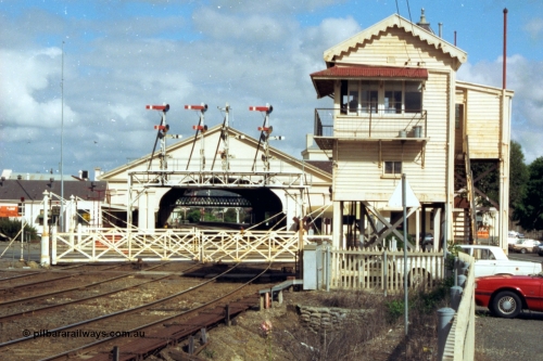 139-15
Ballarat station view, Ballarat B Signal Box at Lydiard St showing the interlocked gates and looking through to the semaphore signal gantry and station building and canopy. The signal posts on the gantry are from the left, 
