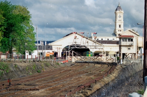 139-20
Ballarat, Australian National broad gauge BL class BL 32 Clyde Engineering EMD model JT26C-2SS serial 83-1016 leading a down Adelaide goods pauses at Ballarat station under the canopy and clock tower, view of Lydiard Street Ballarat B signal box, interlocked gates and semaphore signal gantry, 119 km post, looking east.
Keywords: BL-class;BL32;Clyde-Engineering-Rosewater-SA;EMD;JT26C-2SS;83-1016;