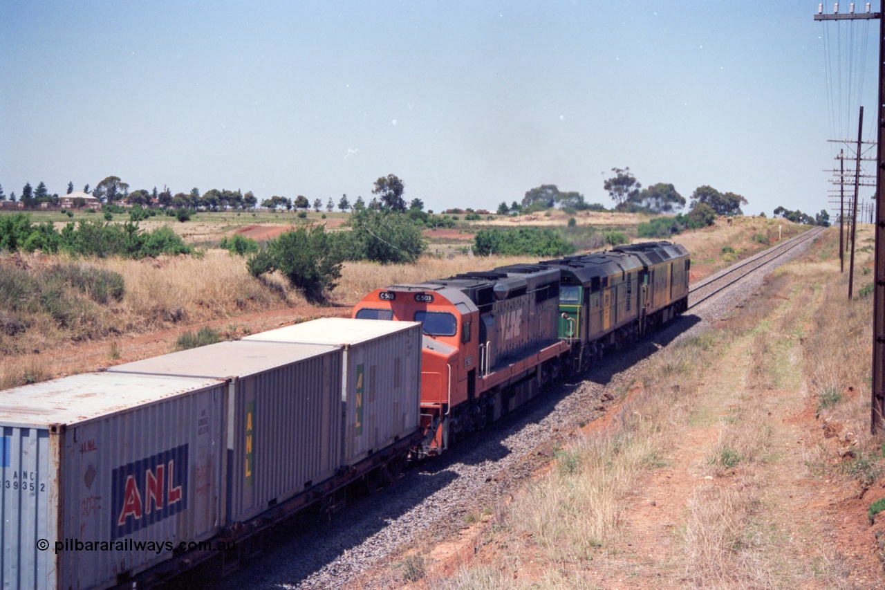 140-1-03
Parwan, up broad gauge Melbourne bound goods climbing Parwan Bank from Bacchus Marsh, could be 9150? Australian National locos BL class Clyde Engineering EMD model JT26C-2SS and 700 class AE Goodwin ALCo model DL500G combined with V/Line C class C 503 Clyde Engineering EMD model GT26C serial 76-826 provide the power.
Keywords: C-class;C503;Clyde-Engineering-Rosewater-SA;EMD;GT26C;76-826;