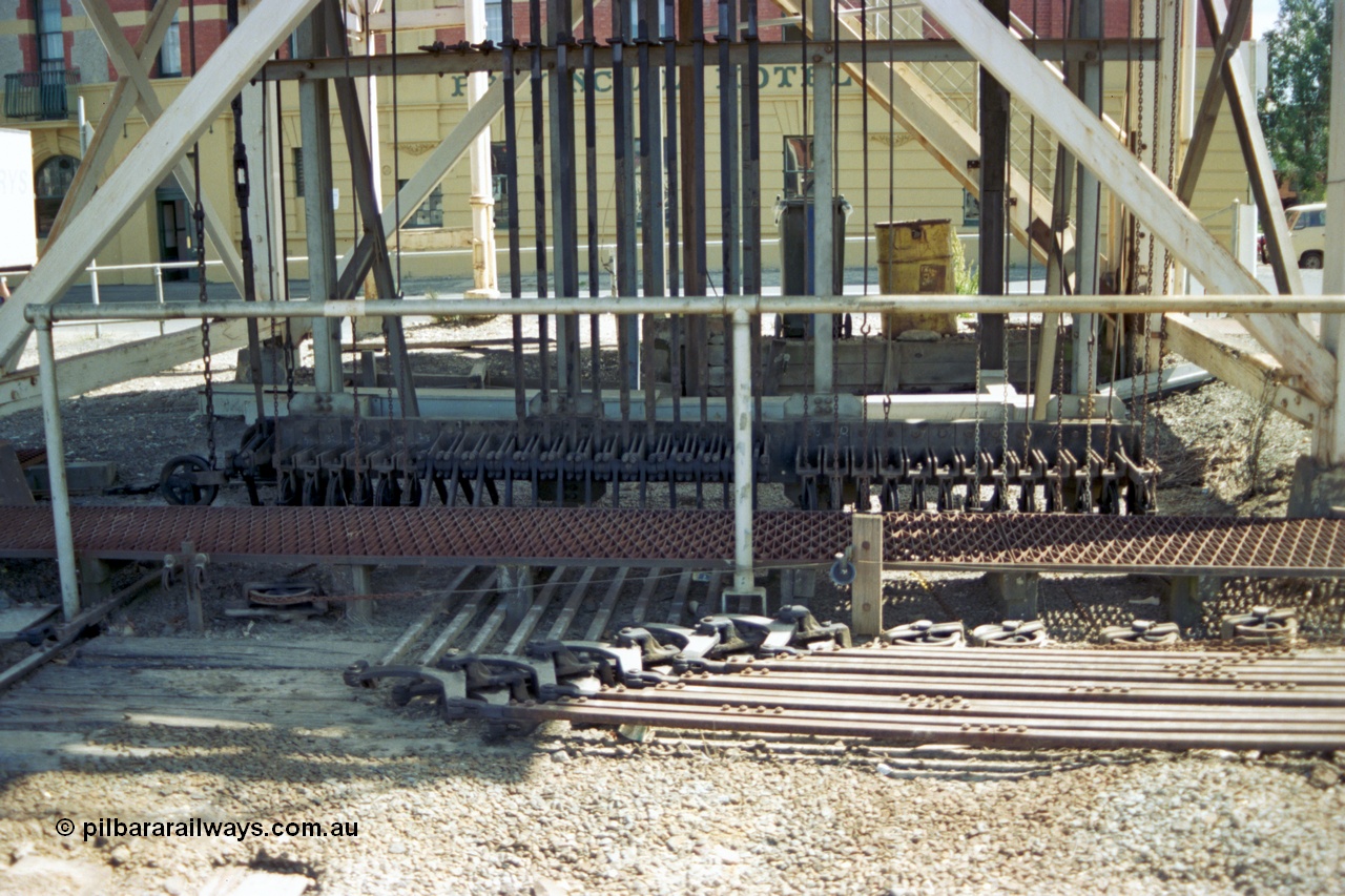 140-1-18
Ballarat B Signal Box at Lydiard St, view of the signal wires and point rodding underneath the signal box, the chain on the left is for the interlocked gates.
