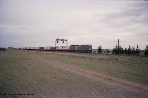 140-2-21
Deer Park West, Australian National broad gauge BL class locomotive Clyde Engineering EMD model JT26C-2SS in AN livery leading a down Adelaide bound goods train.
Keywords: BL-class;Clyde-Engineering-Rosewater-SA;EMD;JT26C-2SS;