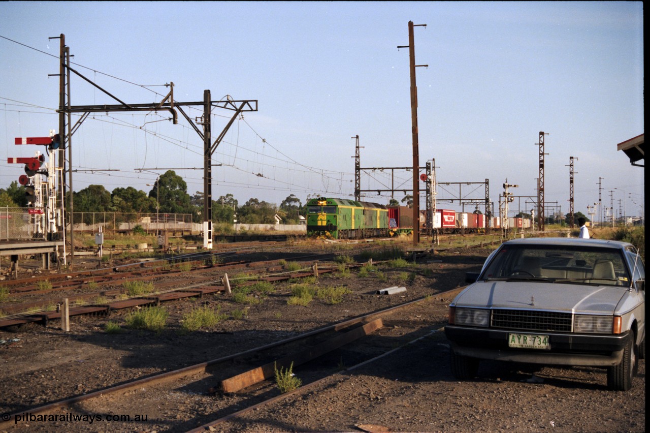 141-1-08
Sunshine, broad gauge Australian National BL class units BL 28 Clyde Engineering EMD model JT26C-2SS serial 83-1012 and BL 27 serial 83-1011 lead the second of the afternoon procession of down Adelaide bound goods trains out of Melbourne along the passenger lines.
Keywords: BL-class;BL28;Clyde-Engineering-Rosewater-SA;EMD;JT26C-2SS;83-1012;