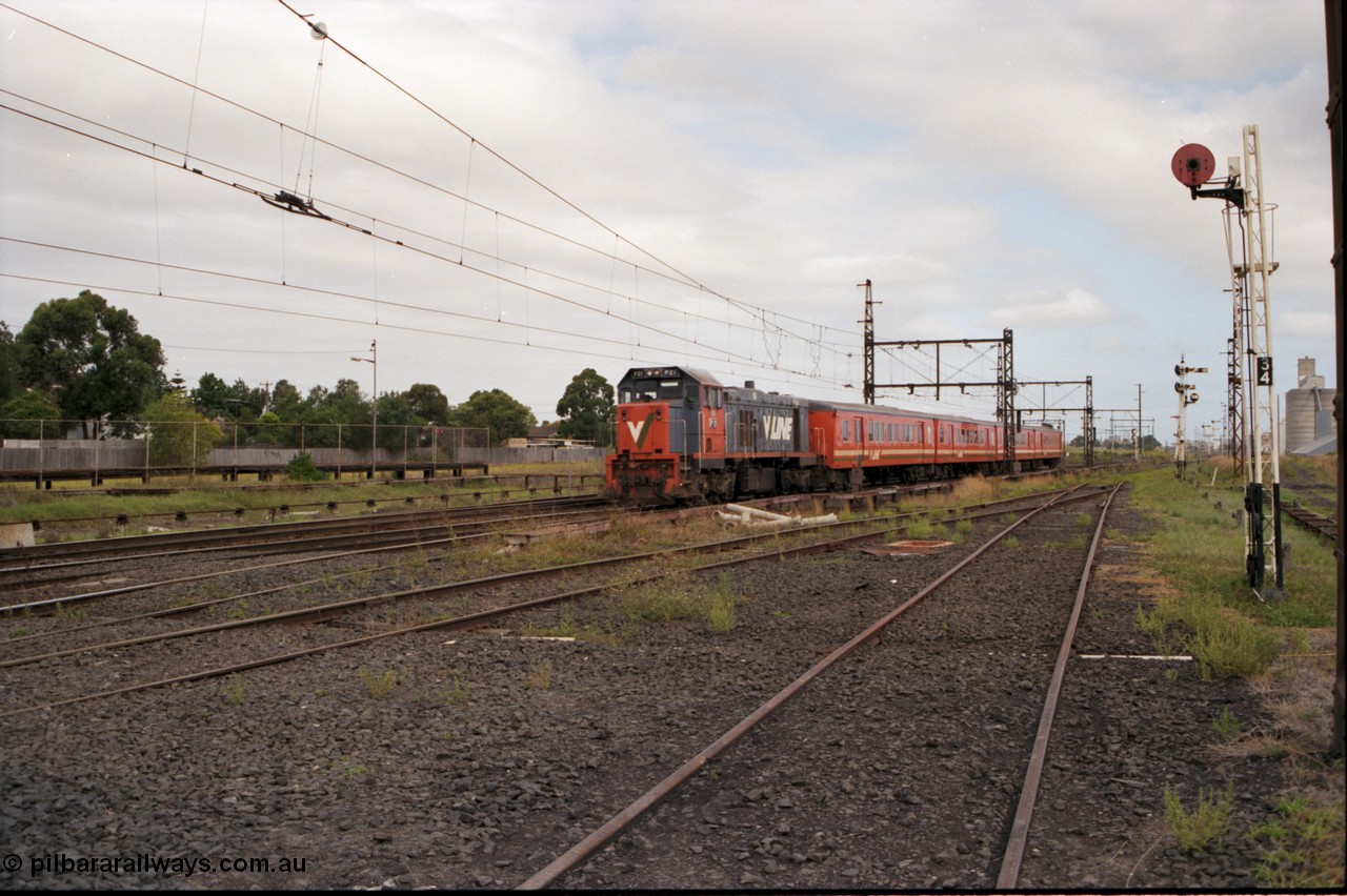 141-1-19
Sunshine, broad gauge V/Line P class P 18 Clyde Engineering EMD model G18HBR serial 84-1211 rebuilt from T 339 Clyde Engineering EMD model G8B serial 56-115 leads a 4 car H set with a down passenger train, on the right is disc signal post 34 which is for up moves from No. 4 road to the Loop Line, behind it is post 35 which is for down moves to No. 3 or 4 roads, I'm standing on 4 road, 3 road is to the left, the standard gauge platform is left of the train.
Keywords: P-class;P18;Clyde-Engineering-Somerton-Victoria;EMD;G18HBR;84-1211;rebuild;