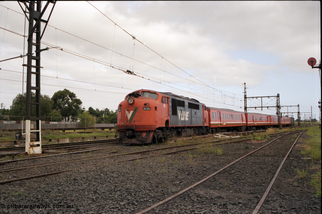 141-1-20
Sunshine, broad gauge V/Line A class loco A 70 Clyde Engineering EMD model AAT22C-2R serial 84-1187 rebuilt from B 70 Clyde Engineering EMD model ML2 serial ML2-11 leads a 4 car H set with a PH power van on the rear as it heads into platform 3 with a down Bacchus Marsh pass.
Keywords: A-class;A70;Clyde-Engineering-Rosewater-SA;EMD;AAT22C-2R;84-1187;rebuild;bulldog;