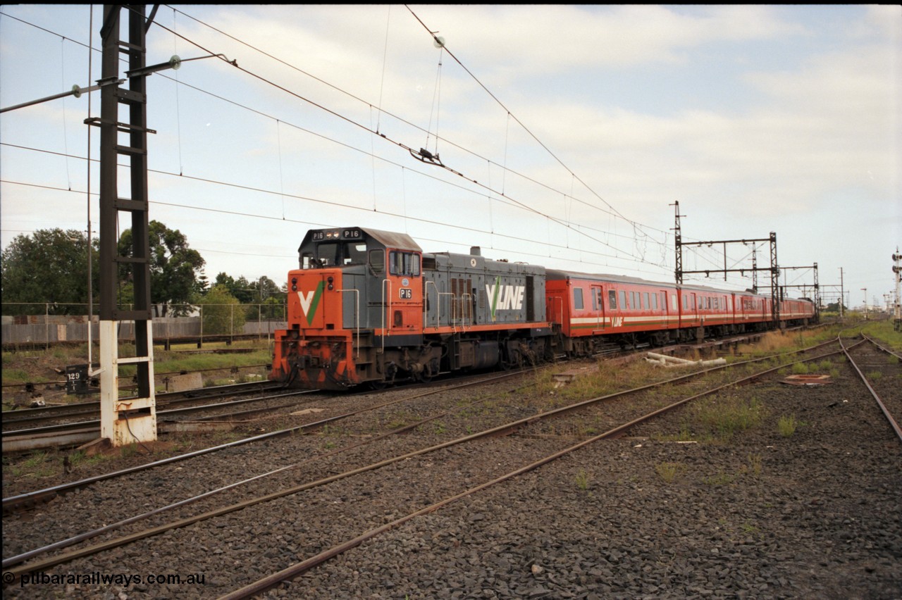 141-1-22
Sunshine, broad gauge V/Line P class P 16 Clyde Engineering EMD model G18HBR serial 84-1210 rebuilt from T 332 Clyde Engineering EMD model G8B serial 56-99 works a 6 car double H set push-pull down passenger with another P class on the rear.
Keywords: P-class;P16;Clyde-Engineering-Somerton-Victoria;EMD;G18HBR;84-1210;rebuild;