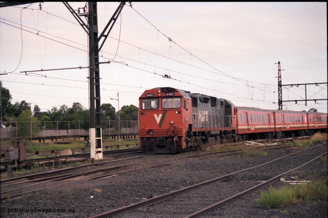 141-1-23
Sunshine, broad gauge V/Line N class N 465 'City of Ballaarat' Clyde Engineering EMD model JT22HC-2 serial 86-1194 leads a H set into platform 3 with a down passenger service to Bacchus Marsh, the passenger platform for the standard gauge is in the background.
Keywords: N-class;N465;Clyde-Engineering-Somerton-Victoria;EMD;JT22HC-2;86-1194;