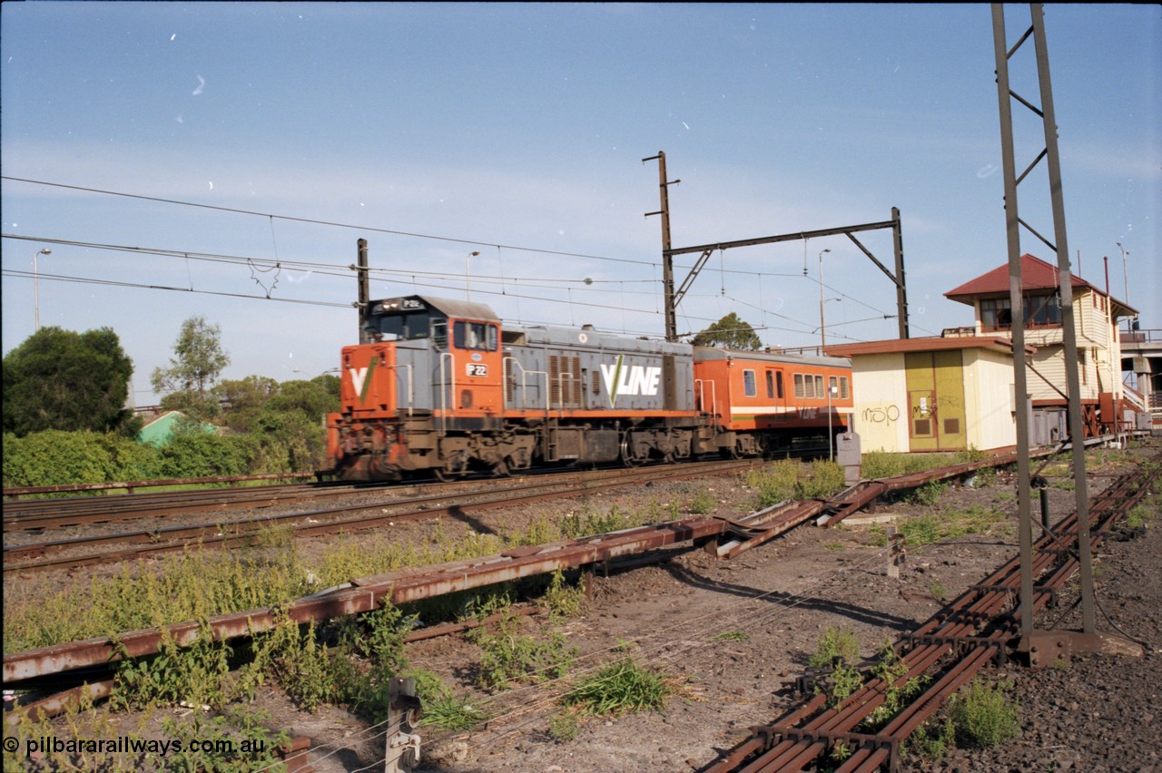 141-2-12
Sunshine, broad gauge V/Line P class P 22 Clyde Engineering EMD model G18HBR serial 84-1215 rebuilt from T 328 Clyde Engineering EMD model G8B serial 56-80 and H set hurries away with a down Sunbury passenger train on the northern lines, the elevated signal box and electric room for the point machines is at right, point rodding.
Keywords: P-class;P21;Clyde-Engineering-Somerton-Victoria;EMD;G18HBR;84-1215;rebuild;