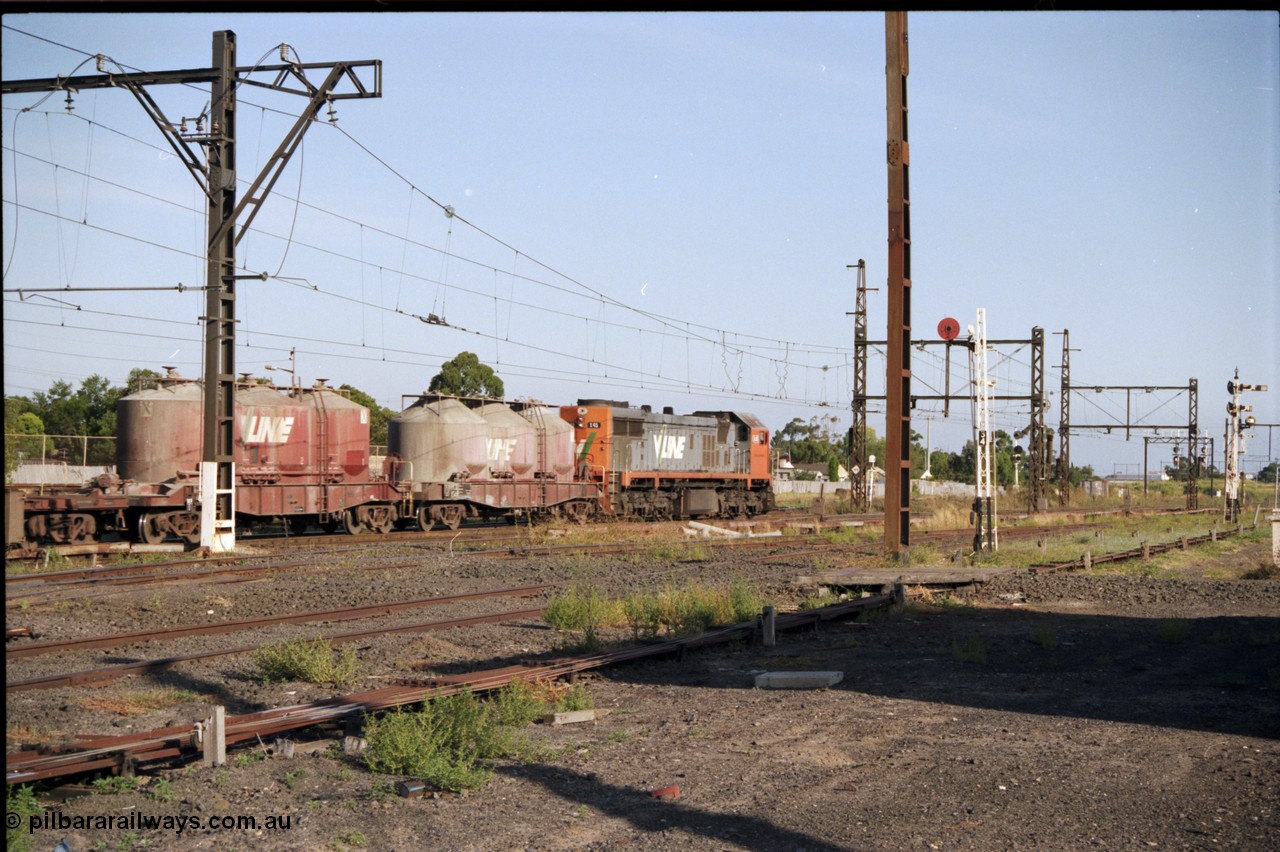 141-2-19
Sunshine, broad gauge V/Line X class X 45 'Edgar H Brownbill' Clyde Engineering EMD model G26C serial 75-792 leads an up Bendigo goods train through Sunshine bound for Tottenham Yard, in this trailing view two VPCX class bogie cement waggons are leading consist.
Keywords: X-class;X45;Clyde-Engineering-Rosewater-SA;EMD;G26C;75-792;