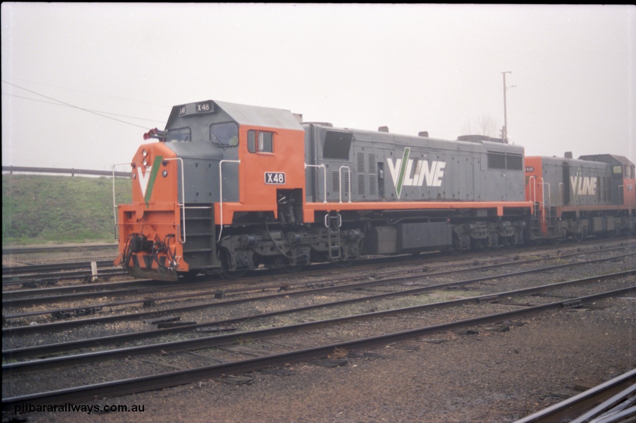 142-1-11
Benalla yard view, stabled broad gauge Wodonga goods train 9303 with V/Line X class X 48 Clyde Engineering EMD model G26C serial 75-795 and T class T 408 Clyde Engineering EMD model G18B serial 68-624.
Keywords: X-class;X48;Clyde-Engineering-Rosewater-SA;EMD;G26C;75-795;