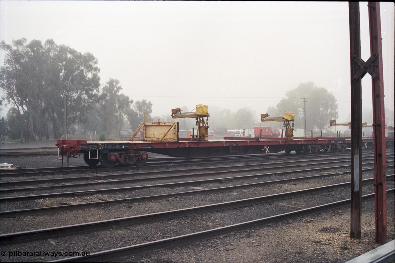 142-1-17
Benalla yard, V/Line broad gauge VZRF type bogie welded rail transport waggon VZRF 305. Built at Victorian Railways Newport Workshops in January 1970 as SKX type long bogie type flat waggon SKX 46, re-classed to SKF in 1973, then VFKW in 1981, then May 1984 converted to VFRY type VFRY 305 at Ararat.
Keywords: VZRF-type;VZRF305;Victorian-Railways-Newport-WS;SKX-type;