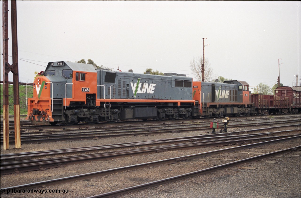 142-1-24
Benalla yard view, stabled broad gauge Wodonga goods train 9303 with V/Line X class X 48 Clyde Engineering EMD model G26C serial 75-795 and T class T 408 Clyde Engineering EMD model G18B serial 68-624, dwarf disc signal 13 and point indicator, track view, point rodding.
Keywords: X-class;X48;Clyde-Engineering-Rosewater-SA;EMD;G26C;75-795;