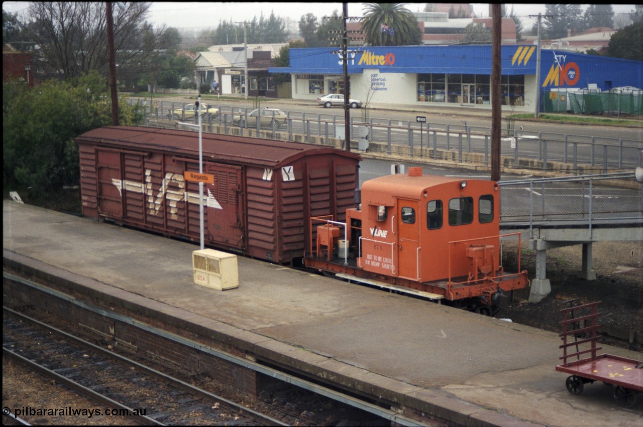 142-2-03
Wangaratta station platform and car dock road, V/Line rail tractor RT class RT 5 with VLBY type bogie louvre van VLBY 148 in VR livery, the standard gauge line is in the concrete cutting behind the RT class. RT 5 built new by Newport Workshops 06/09/1957. The VLBY which is the Wangaratta parcels waggon started out being built by Newport Workshops 30/10/1956 as a VP type VP 148, in May 1979 recoded to VLPY, recoded again in 1982 to VLBY.
Keywords: RT-class;RT5;Victorian-Railways-Newport-WS;VLBY-type;VLBY148;VP-type;VLPY-type;