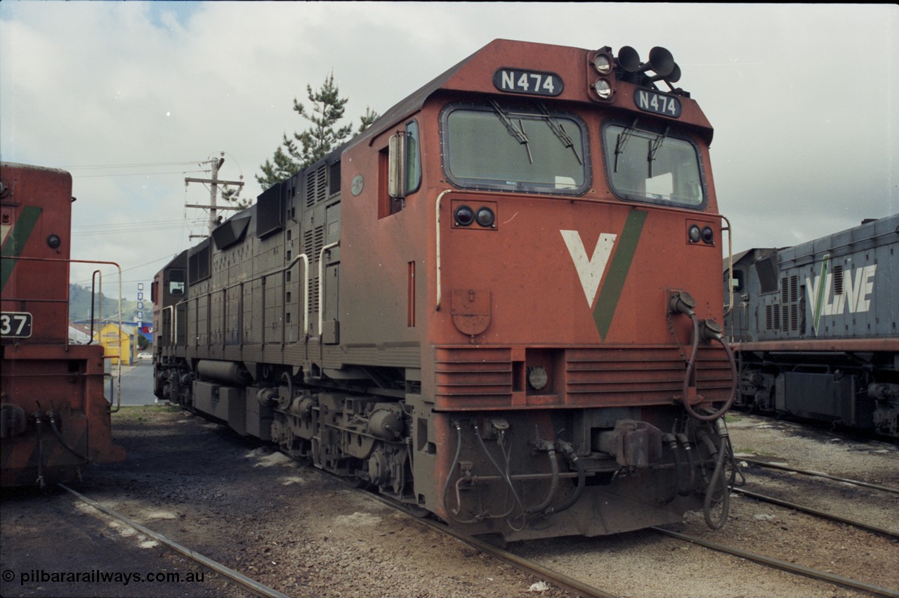 142-2-12
Wodonga loco depot, turntable roads, V/Line broad gauge N class loco N 474 'City of Traralgon' Clyde Engineering EMD model JT22HC-2 serial 87-1203 rests between jobs at the turntable.
Keywords: N-class;N474;Clyde-Engineering-Somerton-Victoria;EMD;JT22HC-2;87-1203;