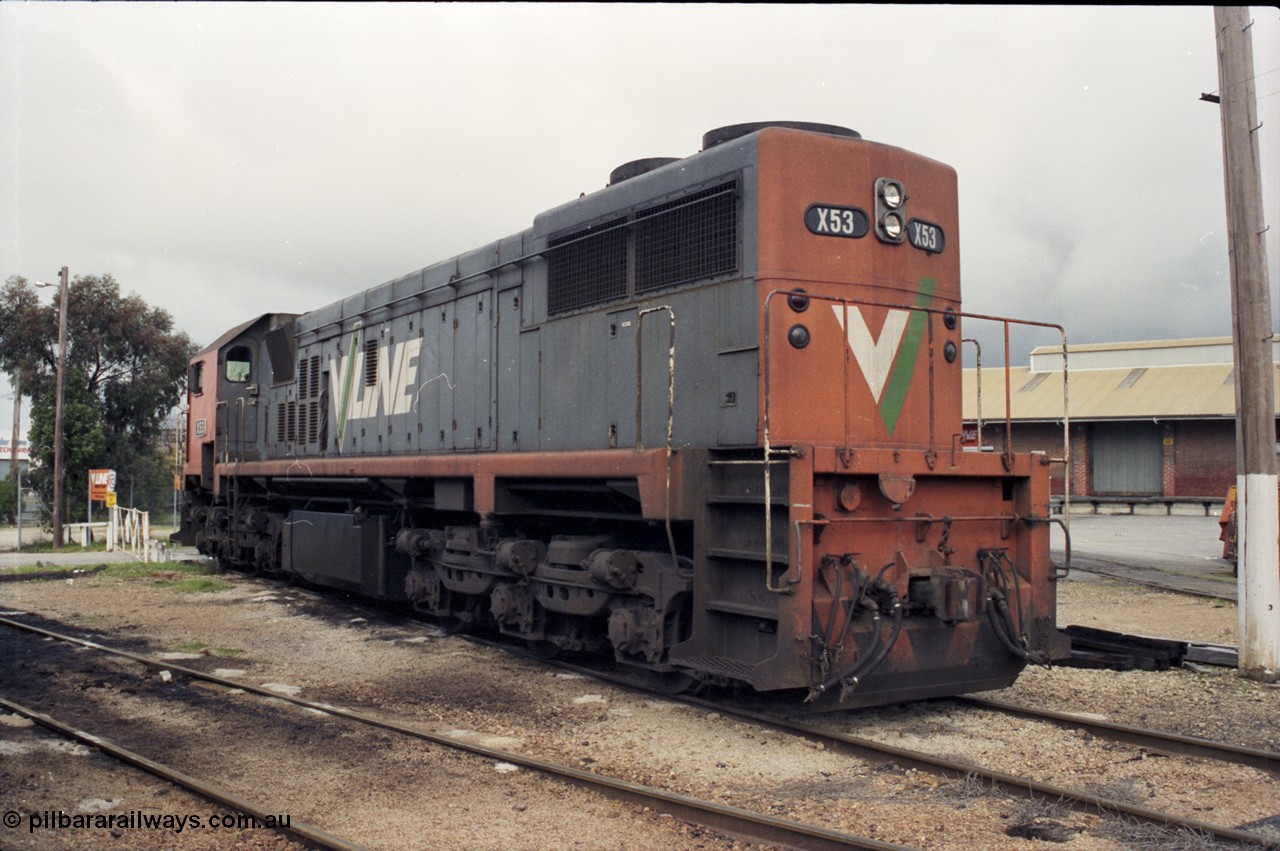 142-2-13
Wodonga loco depot, turntable roads, broad gauge V/Line X class loco X 53 with serial 75-800 a Clyde Engineering Rosewater SA built EMD model G26C rests between jobs at the turntable, goods shed at right, long end view.
Keywords: X-class;X53;Clyde-Engineering-Rosewater-SA;EMD;G26C;75-800;