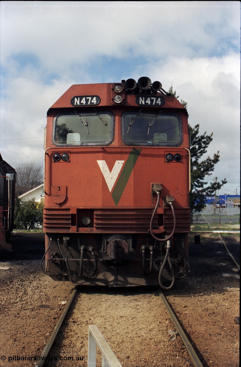 142-2-14
Wodonga loco depot, turntable roads, V/Line broad gauge N class loco N 474 'City of Traralgon' Clyde Engineering EMD model JT22HC-2 serial 87-1203 rests between jobs at the turntable, cab front view.
Keywords: N-class;N474;Clyde-Engineering-Somerton-Victoria;EMD;JT22HC-2;87-1203;