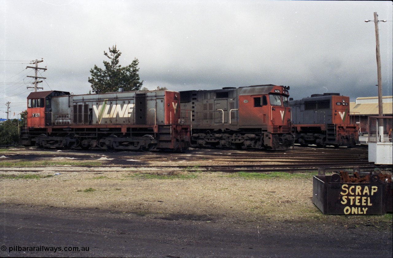 142-2-16
Wodonga loco depot turntable roads, stabled V/Line broad gauge locos share the table on a rainy Sunday arvo, Y class Y 137 Clyde Engineering EMD model G6B serial 65-403, N class N 474 'City of Traralgon' Clyde Engineering EMD model JT22HC-2 serial 87-1203 and X class X 53 Clyde Engineering EMD model G26C serial 75-800.
Keywords: Y-class;Y137;Clyde-Engineering-Granville-NSW;EMD;G6B;65-403;