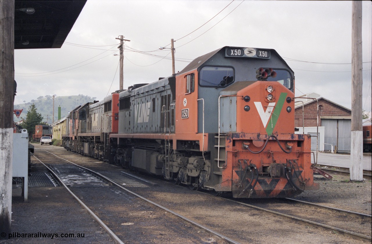 142-2-21
Wodonga loco depot fuel point, V/Line broad gauge loco combination of X class X 50 Clyde Engineering EMD model G26C serial 75-797, X 44 serial 70-707 and T class T 369 Clyde Engineering EMD model G8B serial 64-324 wait for sign on time to run the Sunday evening 9334 up Albury steel train.
Keywords: X-class;X50;Clyde-Engineering-Rosewater-SA;EMD;G26C;75-797;