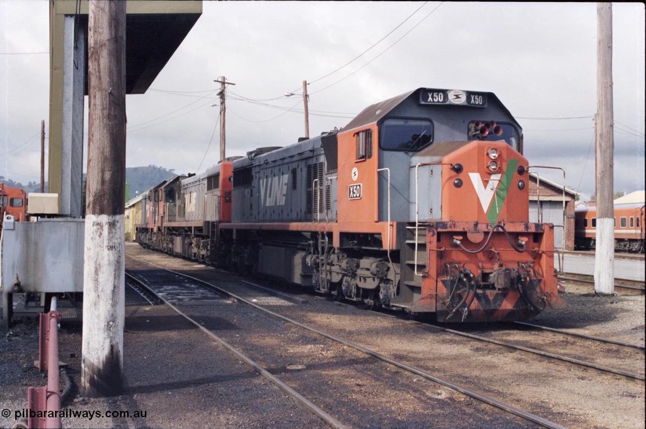 142-2-24
Wodonga loco depot fuel point, V/Line broad gauge loco combination of X class X 50 Clyde Engineering EMD model G26C serial 75-797, X 44 serial 70-707 and T class T 369 Clyde Engineering EMD model G8B serial 64-324 wait for sign on time to run the Sunday evening 9334 up Albury steel train.
Keywords: X-class;X50;Clyde-Engineering-Rosewater-SA;EMD;G26C;75-797;