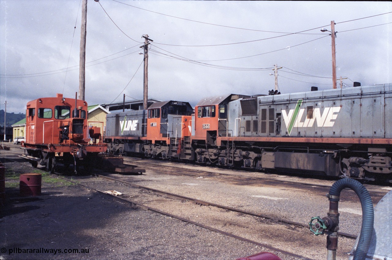 142-2-25
Wodonga loco depot, view across service roads, broad gauge V/Line units RT class rail tractor RT 47, T class T 369 Clyde Engineering EMD model G8B serial 64-324 and X class X 44 Clyde Engineering EMD model G26C serial 70-707.
Keywords: X-class;X44;Clyde-Engineering-Granville-NSW;EMD;G26C;70-707;