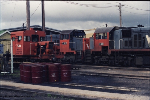 142-2-19
Wodonga loco depot, close up view across service roads, broad gauge V/Line units RT class rail tractor RT 47, T class T 369 Clyde Engineering EMD model G8B serial 64-324 and X class X 44 Clyde Engineering EMD model G26C serial 70-707.
Keywords: X-class;X44;Clyde-Engineering-Granville-NSW;EMD;G26C;70-707;
