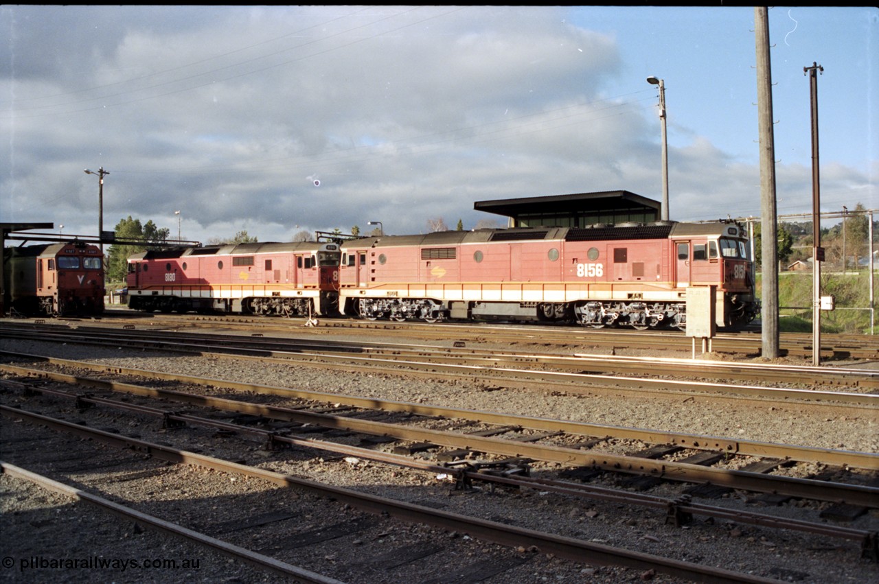 142-3-06
Albury loco depot fuel point sees standard gauge NSWSRA 81 class locos 8156 Clyde Engineering EMD model JT26C-2SS serial 84-1075 and 8180 serial 85-1099 in the candy livery with a V/Line G class at the edge of frame.
Keywords: 81-class;8156;Clyde-Engineering-Kelso-NSW;EMD;JT26C-2SS;84-1075;