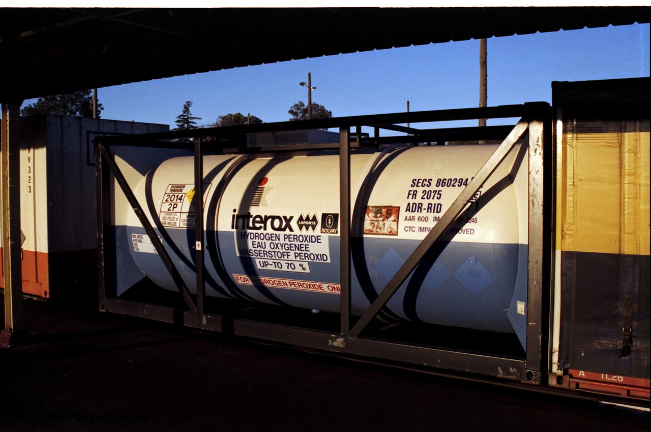 142-3-15
Albury station platform, an ISO 20' Tanktainer for hydrogen peroxide on a Melbourne bound goods train.
