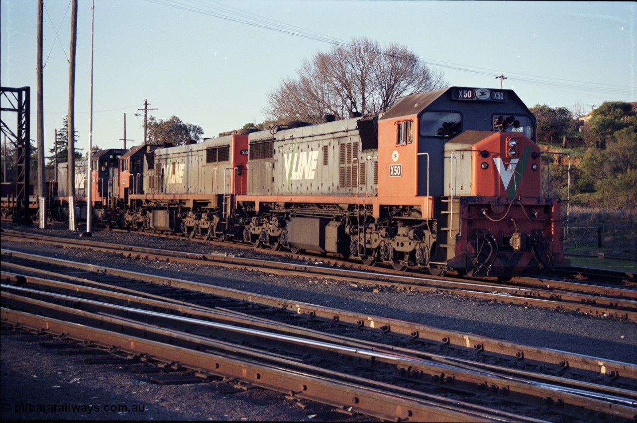 142-3-20
Albury south yard, V/Line broad gauge locos X classes, X 50 Clyde Engineering EMD model G26C serial 75-797 and X 44 serial 70-707 and T class T 369 Clyde Engineering EMD model G8B serial 64-324 are on the point of up Albury steel train 9334, awaiting departure time.
Keywords: X-class;X50;Clyde-Engineering-Rosewater-SA;EMD;G26C;75-797;