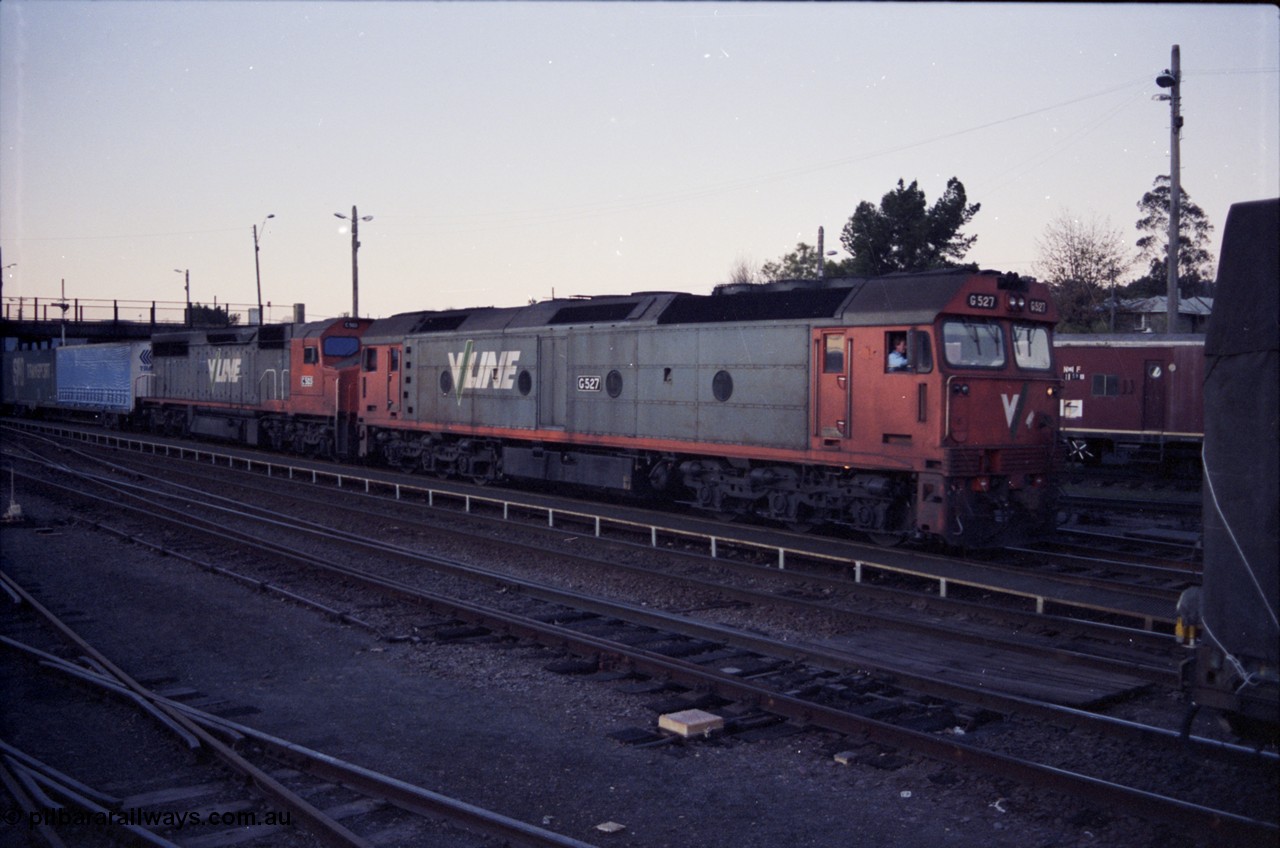 142-3-21
Albury, V/Line standard gauge locomotives G class G 527 Clyde Engineering EMD model JT26C-2SS serial 88-1257 and C class C 503 Clyde Engineering EMD model GT26C serial 76-826 depart Albury yard with a Melbourne bound goods train SM5.
Keywords: G-class;G527;Clyde-Engineering-Somerton-Victoria;EMD;JT26C-2SS;88-1257;