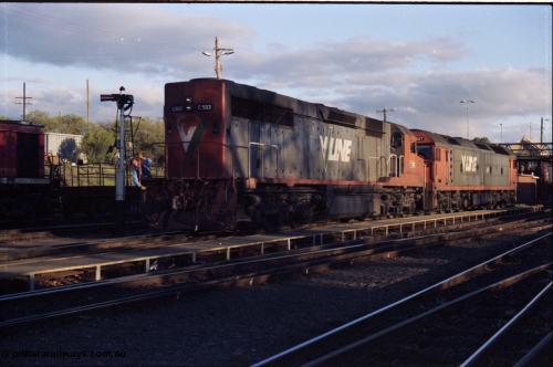 142-3-14
Albury station yard, V/Line standard gauge units C class C 503 Clyde Engineering EMD model GT26C serial 76-826 and G class G 527 Clyde Engineering EMD model JT26C-2SS serial 88-1257 shunt back onto train SM5 after being refuelled at the loco depot, shunter riding loco, semaphore signal.
Keywords: C-class;C503;Clyde-Engineering-Rosewater-SA;EMD;GT26C;76-826;
