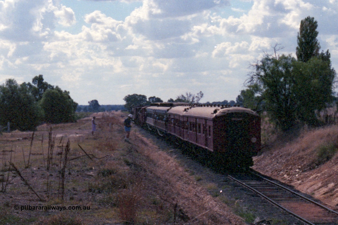 143-23
Rutherglen, down 'Stringybark Express' special climbs up grade towards Wahgunyah having just past under the High St over bridge.
