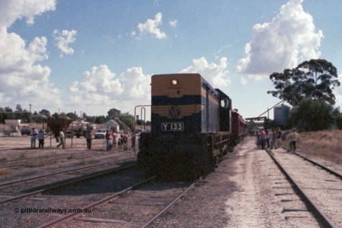 143-28
Wahgunyah, broad gauge VR liveried Y class Y 133 Clyde Engineering EMD model G6B serial 65-399, having run round the consist shunts back onto the 'Stringybark Express' mixed special in the yard, watched by a large number of spectators.
Keywords: Y-class;Y133;Clyde-Engineering-Granville-NSW;EMD;G6B;65-399;
