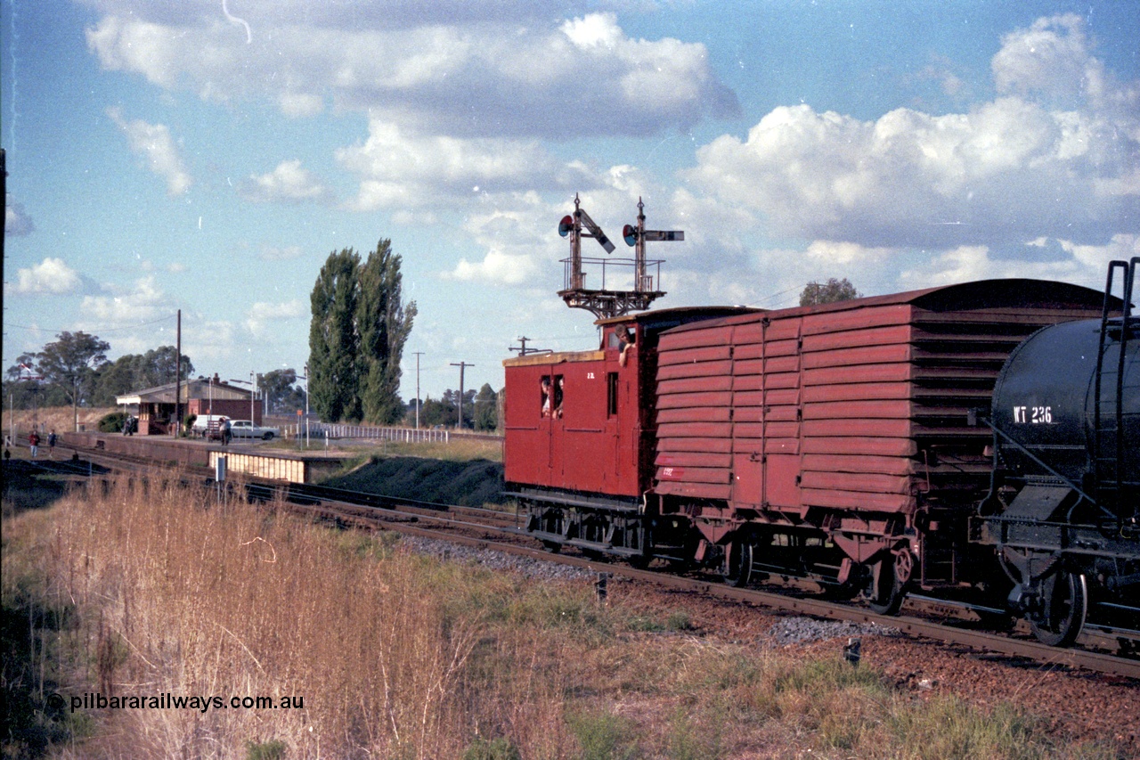 144-06
Springhurst station yard overview as the ZL type six wheel brake van ZL 2 rolls out past Up Home semaphore signal Post 3 on what is the last broad gauge mixed train 'Stringybark Express' to use the Wahgunyah line.
