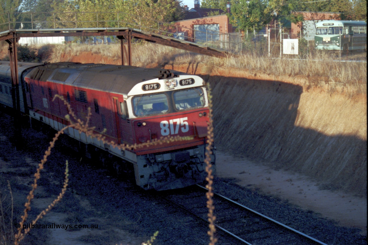 144-13
Wangaratta, standard gauge NSWSRA 81 class 8175 Clyde Engineering EMD model JT26C-2SS serial 85-1094, candy livery, leads the up Inter-Capital Daylight through the cutting and under the footbridge on the way to Melbourne.
Keywords: 81-class;8175;Clyde-Engineering-Kelso-NSW;EMD;JT26C-2SS;85-1094;