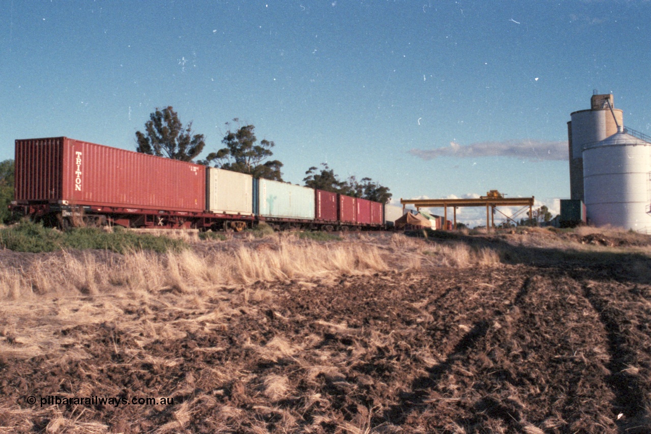 144-36
Boort yard overview, silo complex, containers on waggons, broad gauge V/Line RT class rail tractor RT 42?? in the background, gantry crane. Boort used to have two rail tractors assigned back in these days.
