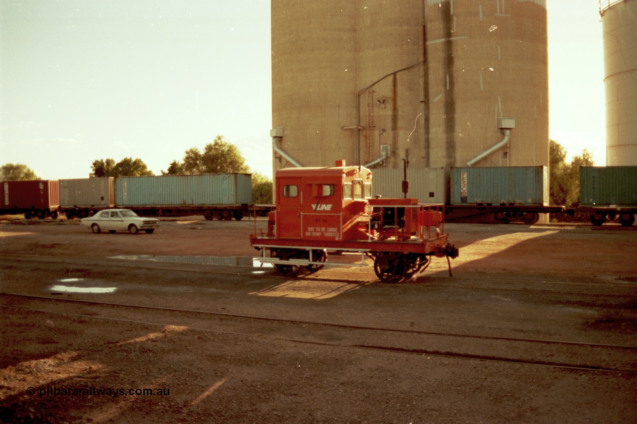 144-37
Boort yard view, silos with loading spouts, containers on waggons, Holden HK sedan and broad gauge V/Line RT class rail tractor RT 14. RT 14 was built new by Newport Workshops June 1959.
Keywords: RT-class;RT14;Victorian-Railways-Newport-WS;