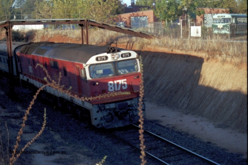 144-13
Wangaratta, standard gauge NSWSRA 81 class 8175 Clyde Engineering EMD model JT26C-2SS serial 85-1094, candy livery, leads the up Inter-Capital Daylight through the cutting and under the footbridge on the way to Melbourne.
Keywords: 81-class;8175;Clyde-Engineering-Kelso-NSW;EMD;JT26C-2SS;85-1094;
