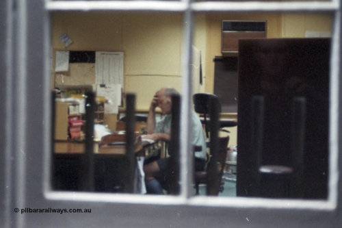 144-20
Euroa, signal man awaits the arrival of the up Wahgunyah 'Stringybark Express' mixed, levers, the photographer is in the window reflection.
