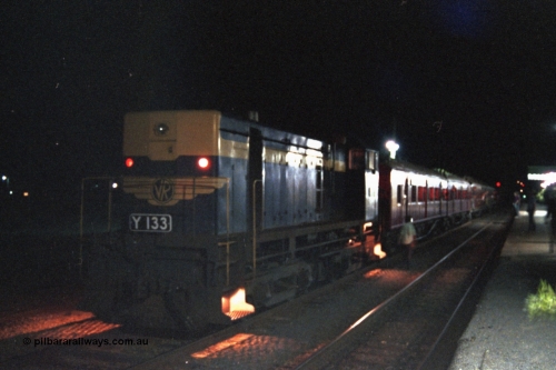 144-21
Euroa station platform view, broad gauge VR liveried Y class Y 133 Clyde Engineering EMD model G6B serial 65-399 with the up Wahgunyah 'Stringybark Express' mixed sits in No. 2 Rd awaiting a cross, night time exposure.
Keywords: Y-class;Y133;Clyde-Engineering-Granville-NSW;EMD;G6B;65-399;