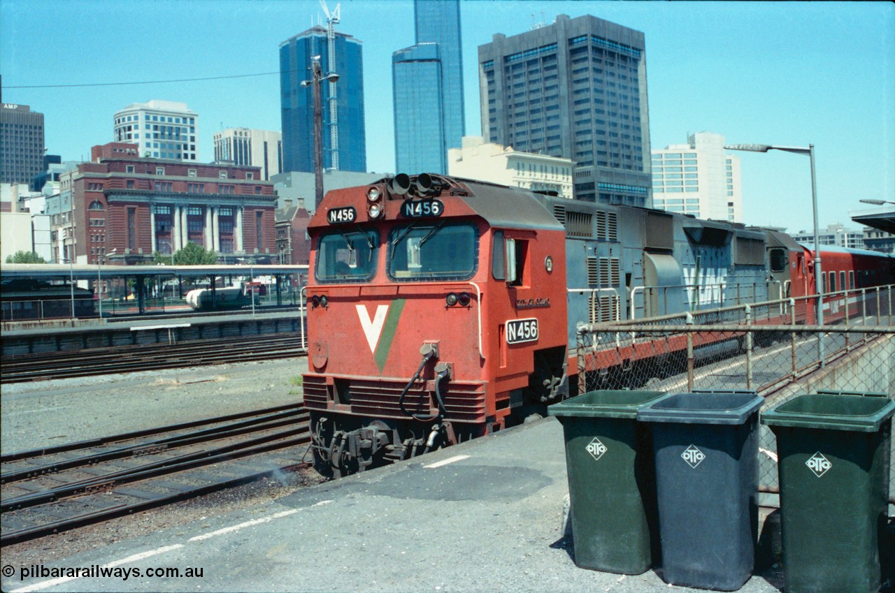 145-07
Spencer Street Station platform No.6 view, old Melbourne skyline, V/Line N class loco N 456 'City of Colac' with serial 85-1224 a Clyde Engineering Somerton Victoria built EMD model JT22HC-2 with a down pass.
Keywords: N-class;N456;Clyde-Engineering-Somerton-Victoria;EMD;JT22HC-2;85-1224;