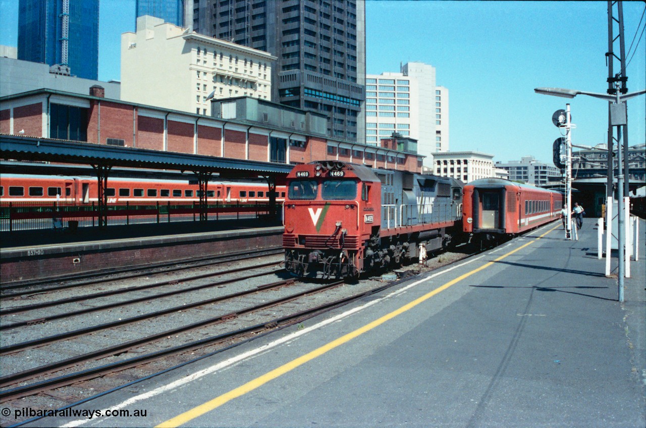 145-08
Spencer Street Station, broad gauge Platform 3, V/Line N class N 469 'City of Morwell' Clyde Engineering EMD model JT22HC-2 serial 86-1198 runs around an N set as a crew walk up the platform.
Keywords: N-class;N469;Clyde-Engineering-Somerton-Victoria;EMD;JT22HC-2;86-1198;