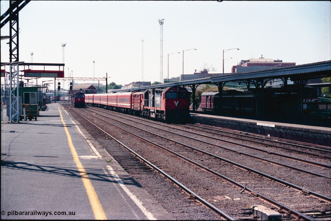 145-09
Spencer Street Station Platform 3 view of board gauge V/Line N class N 453 'City of Albury' Clyde Engineering EMD model JT22HC-2 serial 85-1221 arriving with a 5 car N set into Platform 2 as N class N 469 shunts down in the distance.
Keywords: N-class;N453;Clyde-Engineering-Somerton-Victoria;EMD;JT22HC-2;85-1221;